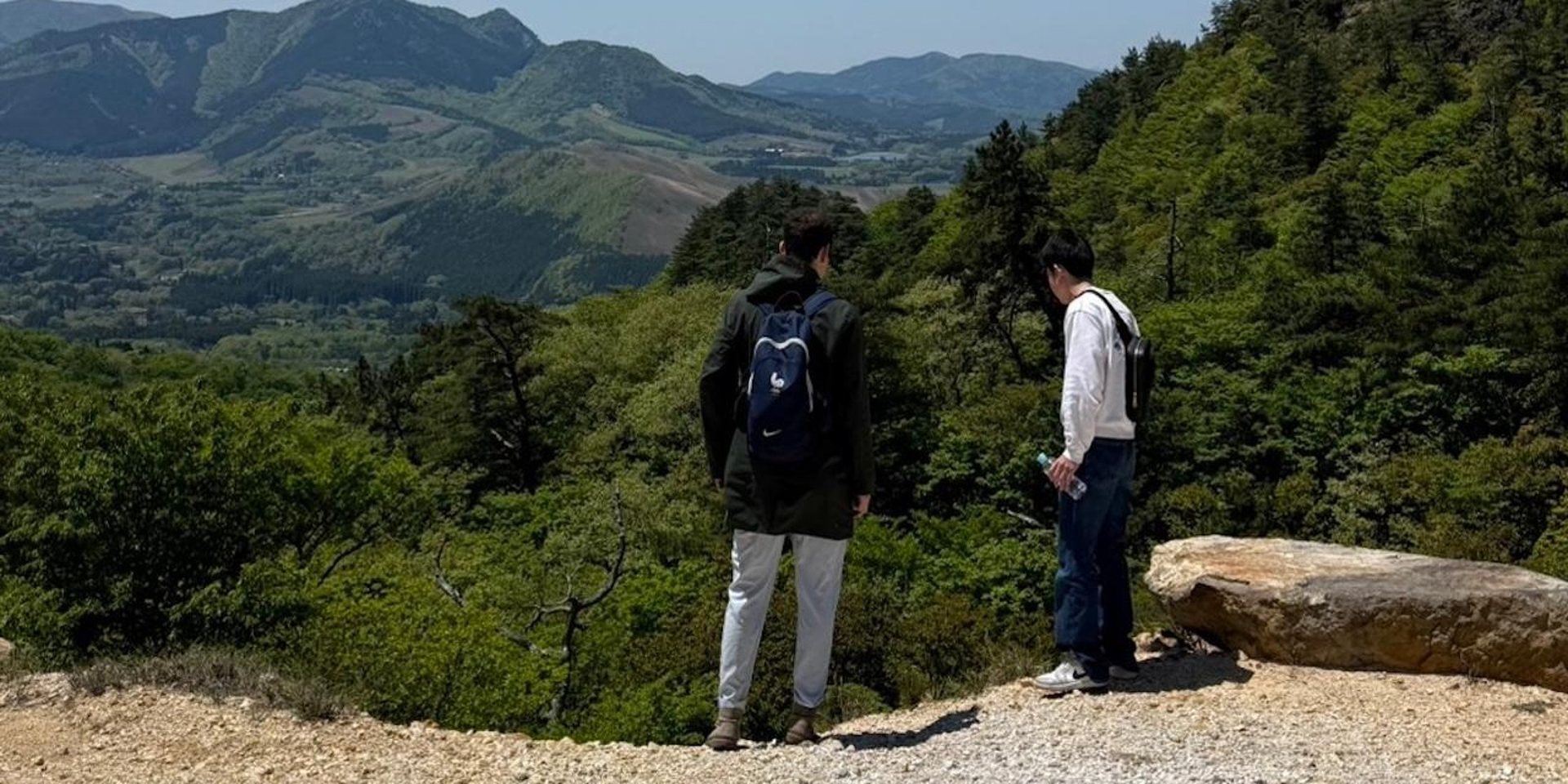 A guest and a ComBi guide looking out over the highlands above Beppu